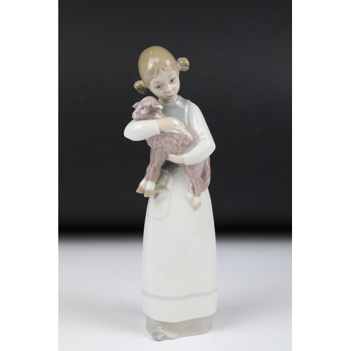 92 - Eight Lladro figures, to include: 5010 'Prissy' (boxed) and 4523 'Little Girl with Slippers