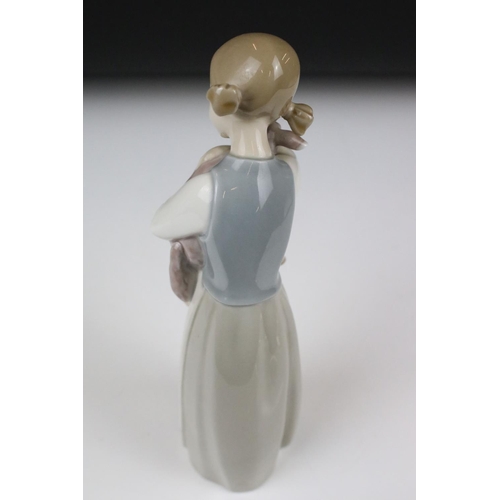 92 - Eight Lladro figures, to include: 5010 'Prissy' (boxed) and 4523 'Little Girl with Slippers