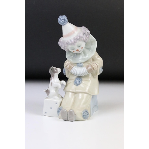 95 - Two Lladro figures, comprising: 5279 'Pierrot with Concertina', 5907 'Sitting Bunny' and two Nao fig... 