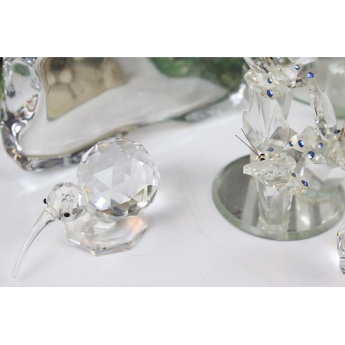 112 - A collection of Swarovski figures, to include a squirrel, a penguin and other similar glass items, t... 