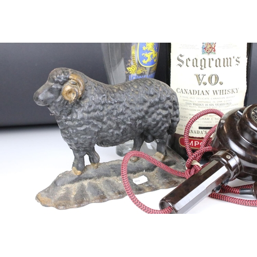 316 - A small group of mixed collectables to include a cast iron door stop in the form of a ram and a mid ... 