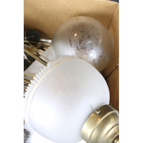 317 - A box of mixed collectables to include light fittings, oil lamp and silver plate.