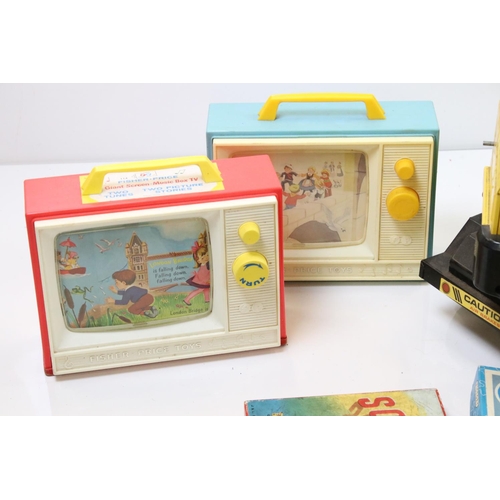 319 - A collection of late 20th century toys to include a large Tonka mobile crane, fisher price record pl... 