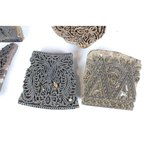 320 - A small collection of carved wooden printing blocks of various patterns.