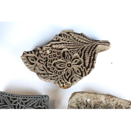 320 - A small collection of carved wooden printing blocks of various patterns.