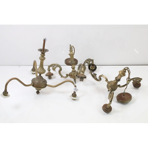 323 - A group of three brass central hanging light fittings to include a pair of three branch examples.