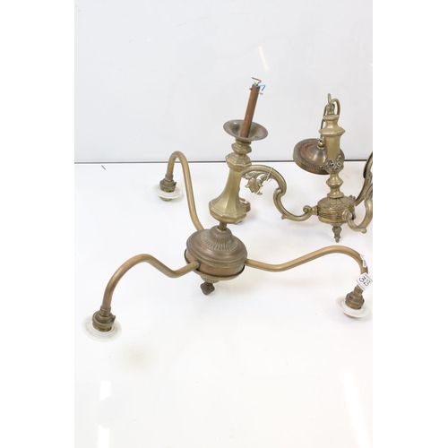 323 - A group of three brass central hanging light fittings to include a pair of three branch examples.