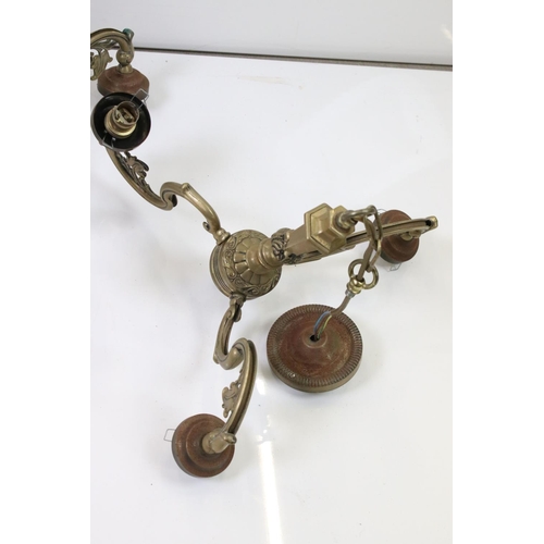 323 - A group of three brass central hanging light fittings to include a pair of three branch examples.