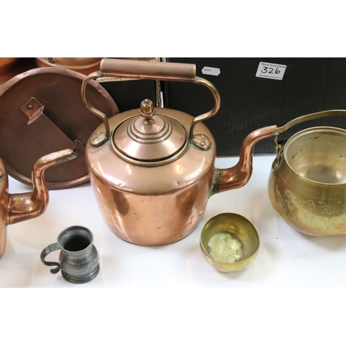 326 - A large collection of mixed brass and copper ware to include teapots, trivets, jugs, pots and plates... 