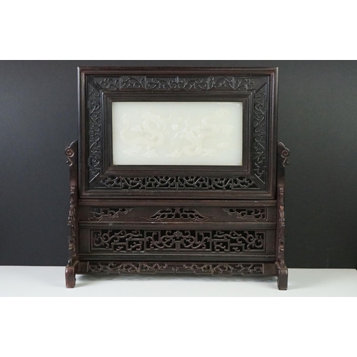 135 - Chinese Pierced Hardwood Table Screen with a Carved Stone Central Panel depicting Dragons, 33cm high... 