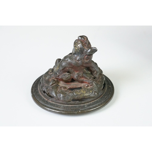 137 - Chinese bronze koro and cover, the pierced lid with a temple dog holding down another creature, the ... 