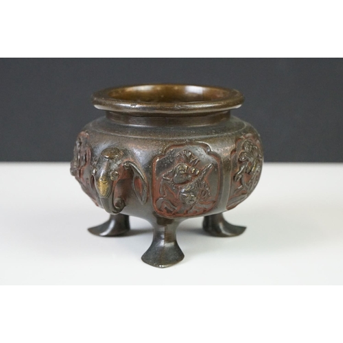 137 - Chinese bronze koro and cover, the pierced lid with a temple dog holding down another creature, the ... 