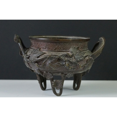 139 - Chinese bronze censer, with impressed square seal mark, applied with grapes and vines, lacking cover... 