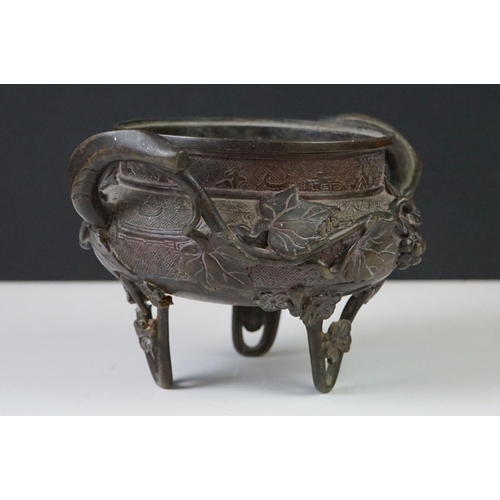 139 - Chinese bronze censer, with impressed square seal mark, applied with grapes and vines, lacking cover... 
