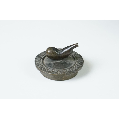 141 - Pair of Chinese bronze miniature kettles with swing handles and lids, the bodies cast with dragons, ... 