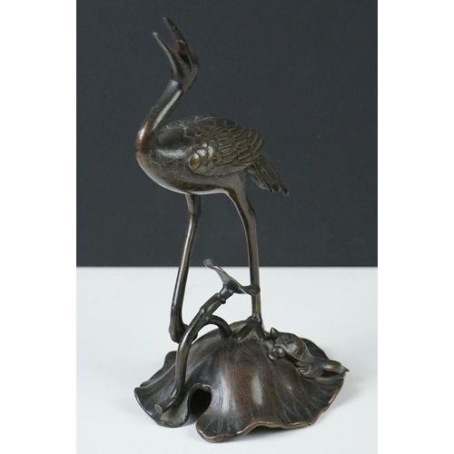 142 - Pair of 19th century bronze groups of a crane standing on a lily pad with a turtle, repaired, approx... 