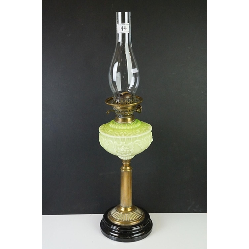 144 - Victorian Oil Lamp with opaque moulded green glass well, brass column support and black socle base, ... 