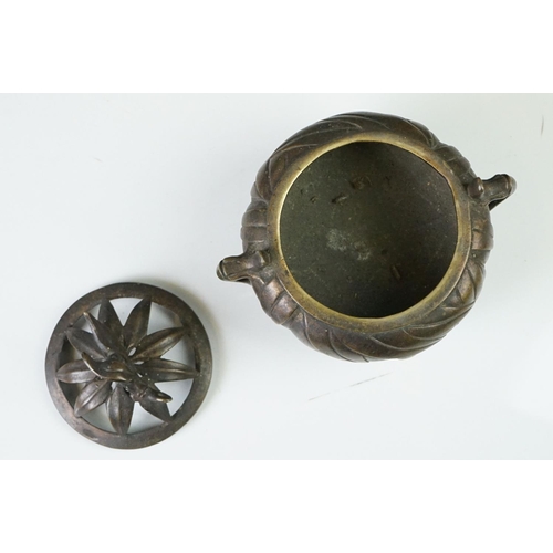 146 - Chinese bronze koro and cover with raised leaf decoration, on four feet