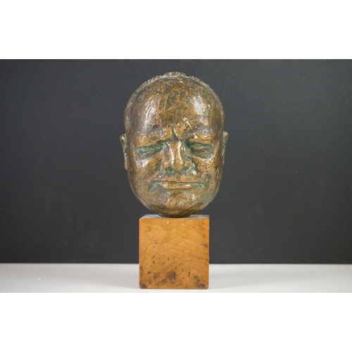 150 - Bronze Bust of Sir Winston Churchill raised on a wooden plinth, 20cm high