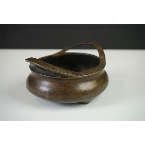 152 - Chinese Bronze Censer with two loop handles, raised on three tripod feet, sixteen character marked t... 