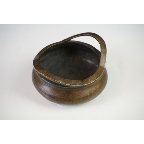 152 - Chinese Bronze Censer with two loop handles, raised on three tripod feet, sixteen character marked t... 