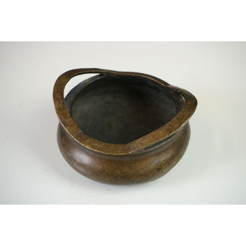 152 - Chinese Bronze Censer with two loop handles, raised on three tripod feet, sixteen character marked t... 