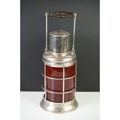 153 - White Metal and Red Glass Cocktail Shaker in the form of a Lantern with swing handle, 32cm high