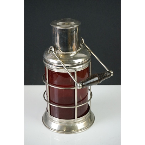 153 - White Metal and Red Glass Cocktail Shaker in the form of a Lantern with swing handle, 32cm high