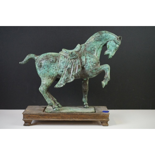 181 - Verdigris Bronze  Figure of a Chinese Tang Horse fitted onto a wooden plinth base, 26cm high togethe... 