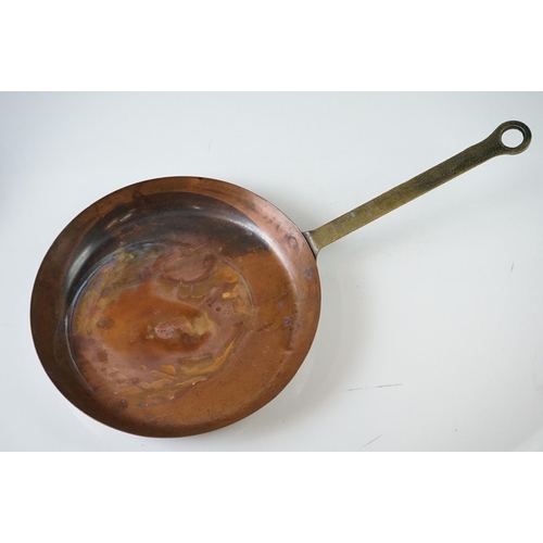 198 - Set of Seven Copper Graduating Frying Pans with brass handles, each pan stamped from 1 to 7, largest... 