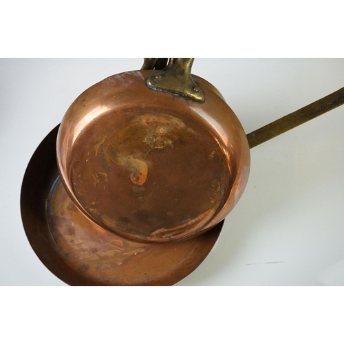 198 - Set of Seven Copper Graduating Frying Pans with brass handles, each pan stamped from 1 to 7, largest... 