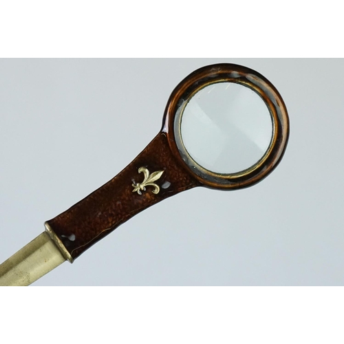 205 - Combination Paper Knife and Magnifying Glass with fleur de lys decoration, 19cm long