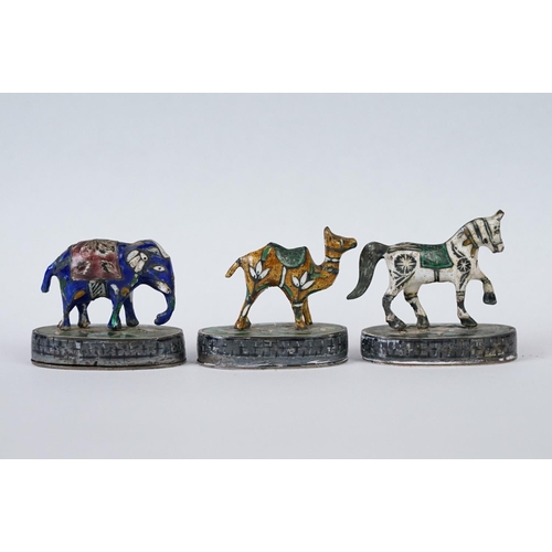 214 - A group of three Indian silver and enamel figures in the form of a camel, elephant and a horse.