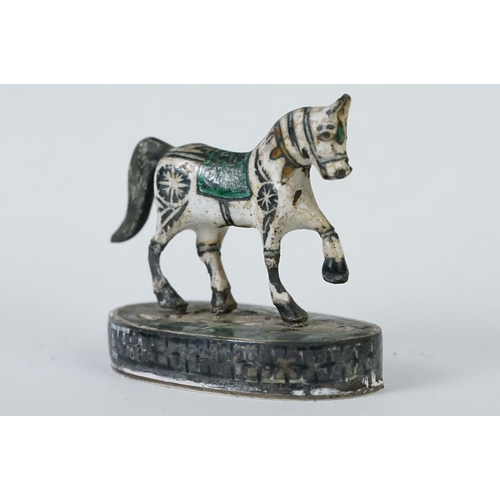 214 - A group of three Indian silver and enamel figures in the form of a camel, elephant and a horse.