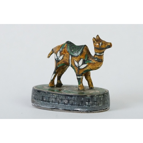 214 - A group of three Indian silver and enamel figures in the form of a camel, elephant and a horse.