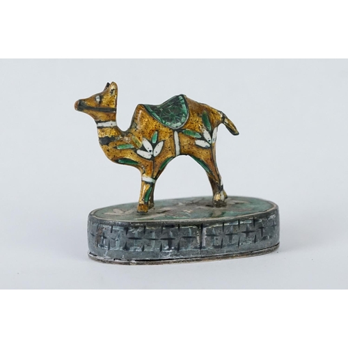 214 - A group of three Indian silver and enamel figures in the form of a camel, elephant and a horse.