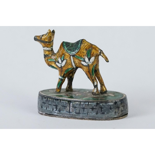 214 - A group of three Indian silver and enamel figures in the form of a camel, elephant and a horse.