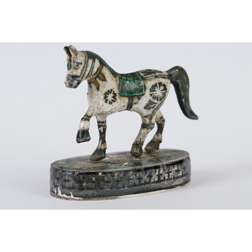 214 - A group of three Indian silver and enamel figures in the form of a camel, elephant and a horse.