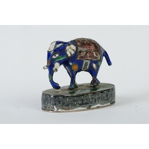 214 - A group of three Indian silver and enamel figures in the form of a camel, elephant and a horse.