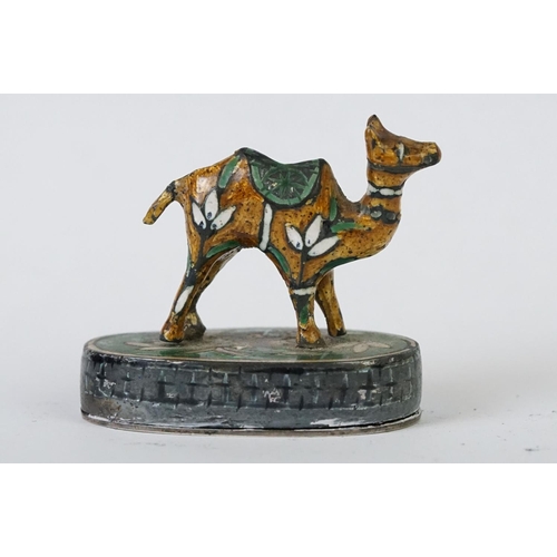 214 - A group of three Indian silver and enamel figures in the form of a camel, elephant and a horse.