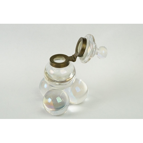 218 - An early 20th century glass bubble inkwell with brass fittings.