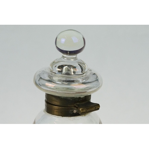 218 - An early 20th century glass bubble inkwell with brass fittings.