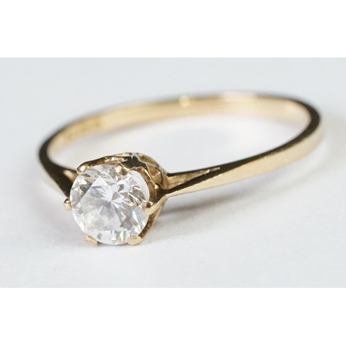 224A - A ladies hallmarked 9ct gold solitaire ring together with a ladies 18ct gold boat ring.