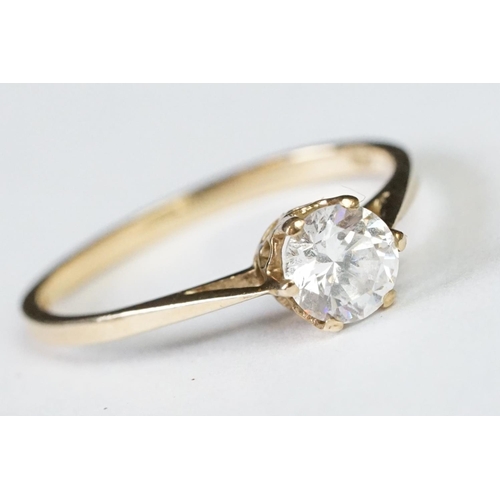 224A - A ladies hallmarked 9ct gold solitaire ring together with a ladies 18ct gold boat ring.