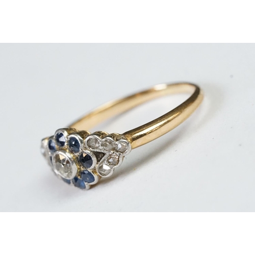 228 - A ladies yellow metal sapphire and diamond dress ring.