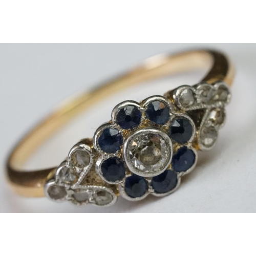 228 - A ladies yellow metal sapphire and diamond dress ring.