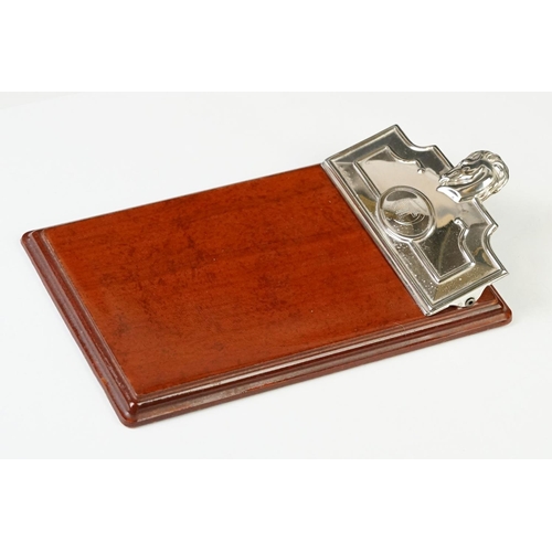 231 - A fully hallmarked sterling silver notebook holder / desk clip mounted to polished wooden mount.