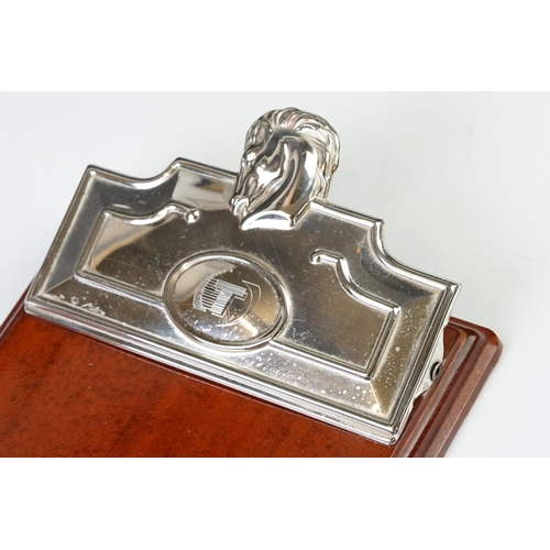 231 - A fully hallmarked sterling silver notebook holder / desk clip mounted to polished wooden mount.