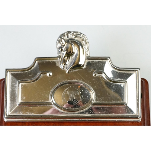 231 - A fully hallmarked sterling silver notebook holder / desk clip mounted to polished wooden mount.