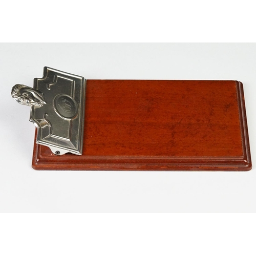 231 - A fully hallmarked sterling silver notebook holder / desk clip mounted to polished wooden mount.